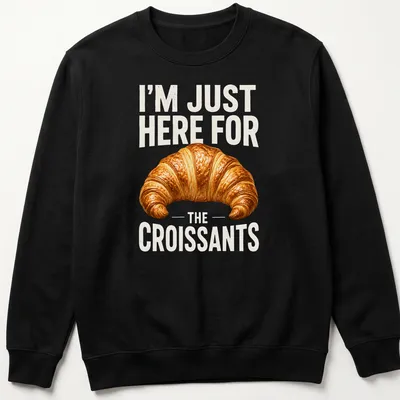 Realistic illustration of a golden brown croissant with text about croissants — printed on a unisex sweatshirt