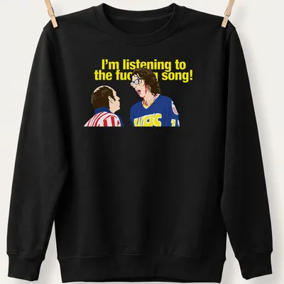 Cartoon T-shirt featuring two characters in hockey jerseys and humorous printed text. — printed on a unisex sweatshirt