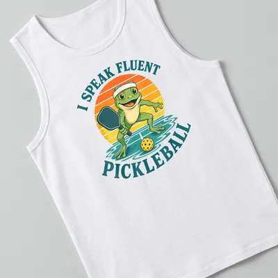 Vintage cartoon frog playing pickleball with humorous text about fluency — printed on a tank top