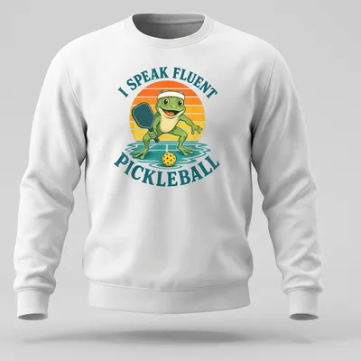 Vintage cartoon frog playing pickleball with humorous text about fluency — printed on a unisex sweatshirt