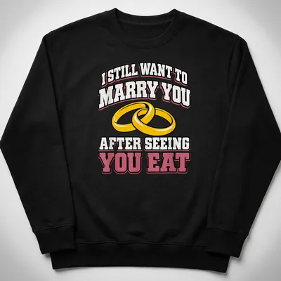 Bold text and wedding rings on a playful t-shirt about love and food — printed on a unisex sweatshirt