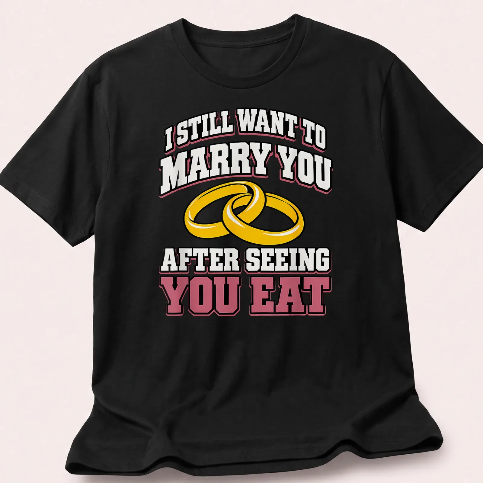 Bold text and wedding rings on a playful t-shirt about love and food — printed on a unisex t-shirt