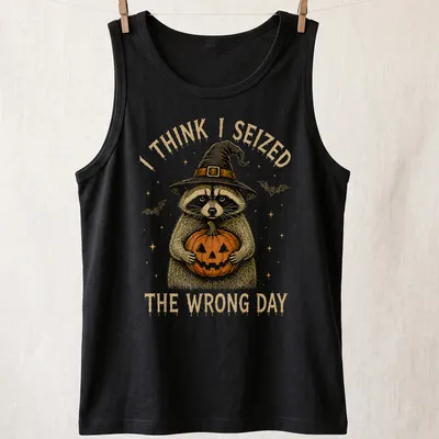 Vintage illustration of a raccoon holding a pumpkin with humorous text — printed on a tank top