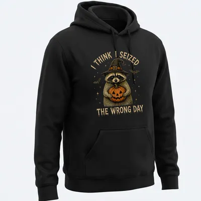 Vintage illustration of a raccoon holding a pumpkin with humorous text — printed on a unisex hoodie