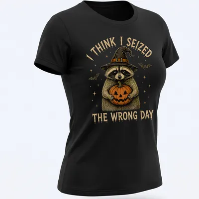 Vintage illustration of a raccoon holding a pumpkin with humorous text — printed on a women's shirt