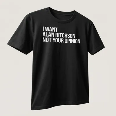 Bold text on a black and white tee expressing a humorous preference for Alan Ritchson. — printed on a unisex t-shirt (angled view)