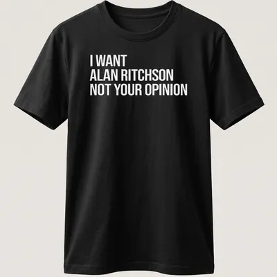 Bold text on a black and white tee expressing a humorous preference for Alan Ritchson.