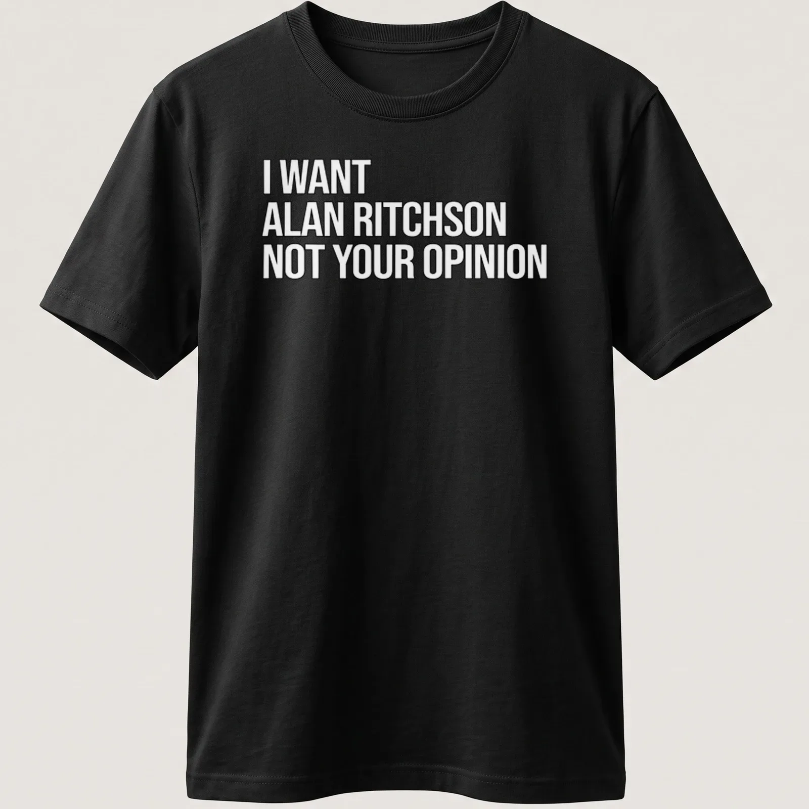 Bold text on a black and white tee expressing a humorous preference for Alan Ritchson. — printed on a unisex t-shirt