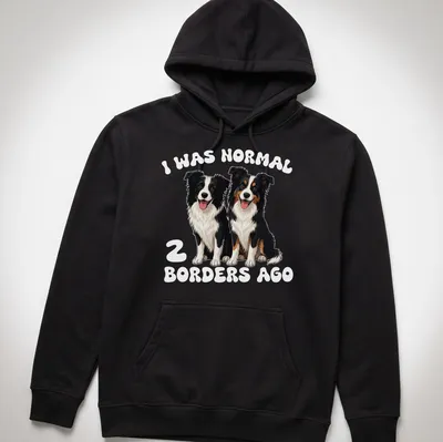 Cartoon dogs with the text I Was Normal 2 Borders Ago humorously printed — printed on a unisex hoodie