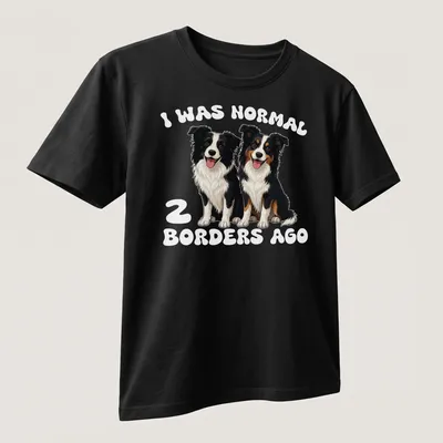 Cartoon dogs with the text I Was Normal 2 Borders Ago humorously printed — printed on a unisex t-shirt (angled view)