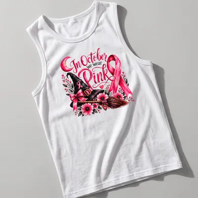 Vintage floral design of a pink witch hat and broom with the text In October we wear Pink — printed on a tank top