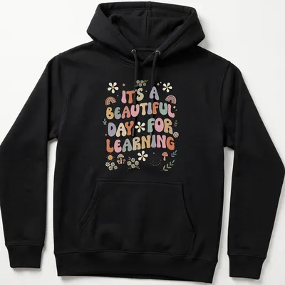 Boho retro tee with colorful text and floral designs about learning — printed on a unisex hoodie