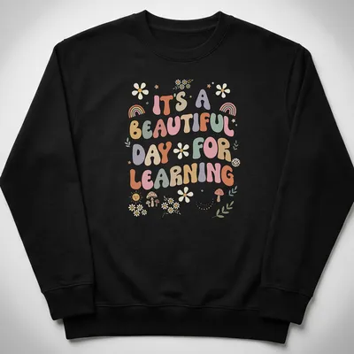Boho retro tee with colorful text and floral designs about learning — printed on a unisex sweatshirt