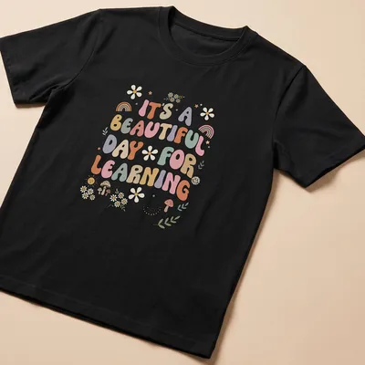 Boho retro tee with colorful text and floral designs about learning