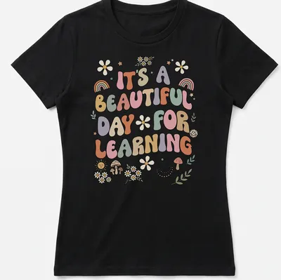 Boho retro tee with colorful text and floral designs about learning — printed on a women's shirt