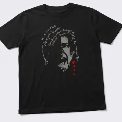 Vintage distressed t-shirt featuring abstract face silhouette and impactful typography
