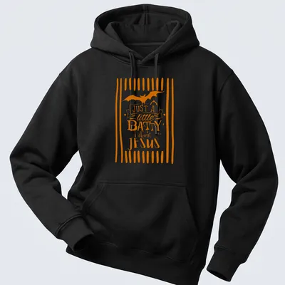 Playful T-shirt featuring a bat and the text 'Just A Little Batty About Jesus' in orange and white — printed on a unisex hoodie