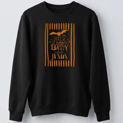 Playful T-shirt featuring a bat and the text 'Just A Little Batty About Jesus' in orange and white — printed on a unisex sweatshirt