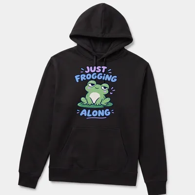 Kawaii design featuring a cute green frog with the phrase Just Frogging Along above it — printed on a unisex hoodie