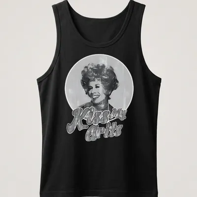 Smiling woman graphic with retro text 'Kiss My Grits' in black, white, and gray. — printed on a tank top
