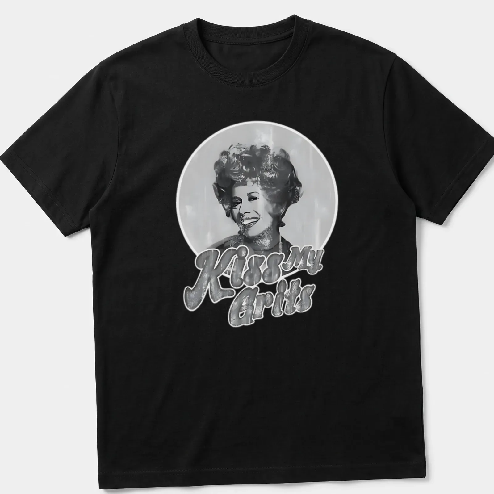 Smiling woman graphic with retro text 'Kiss My Grits' in black, white, and gray. — printed on a unisex t-shirt