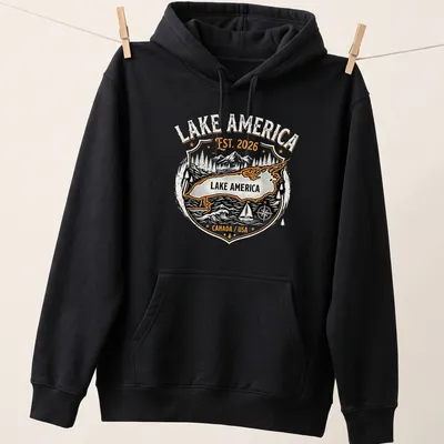 Vintage badge design with Lake America Est. 2026 in orange, black, and white — printed on a unisex hoodie