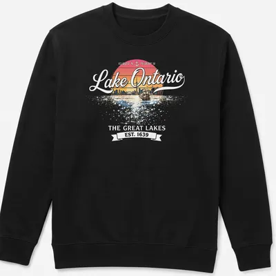 Retro sunset T-shirt featuring a sailboat and city skyline around Lake Ontario — printed on a unisex sweatshirt