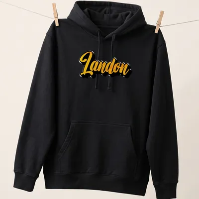 Personalized Landon t-shirt with bold yellow script on a black background — printed on a unisex hoodie
