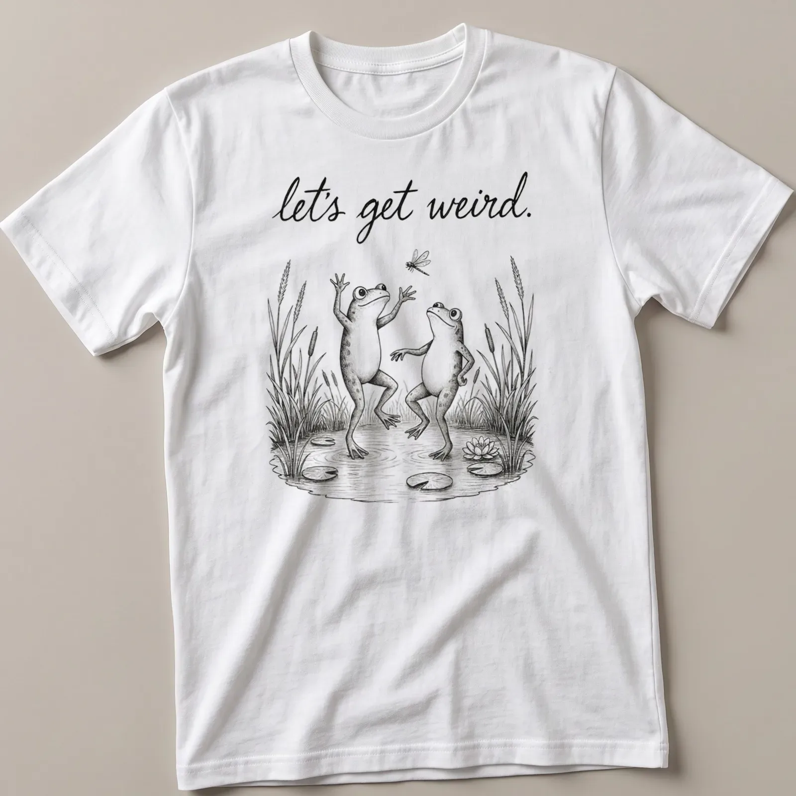 Vintage illustrated frogs dancing under the text 'let's get weird.' in playful font — printed on a unisex t-shirt