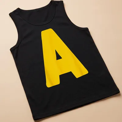Bold yellow Letter A graphic on a Halloween costume — printed on a tank top