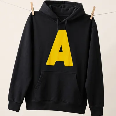 Bold yellow Letter A graphic on a Halloween costume — printed on a unisex hoodie