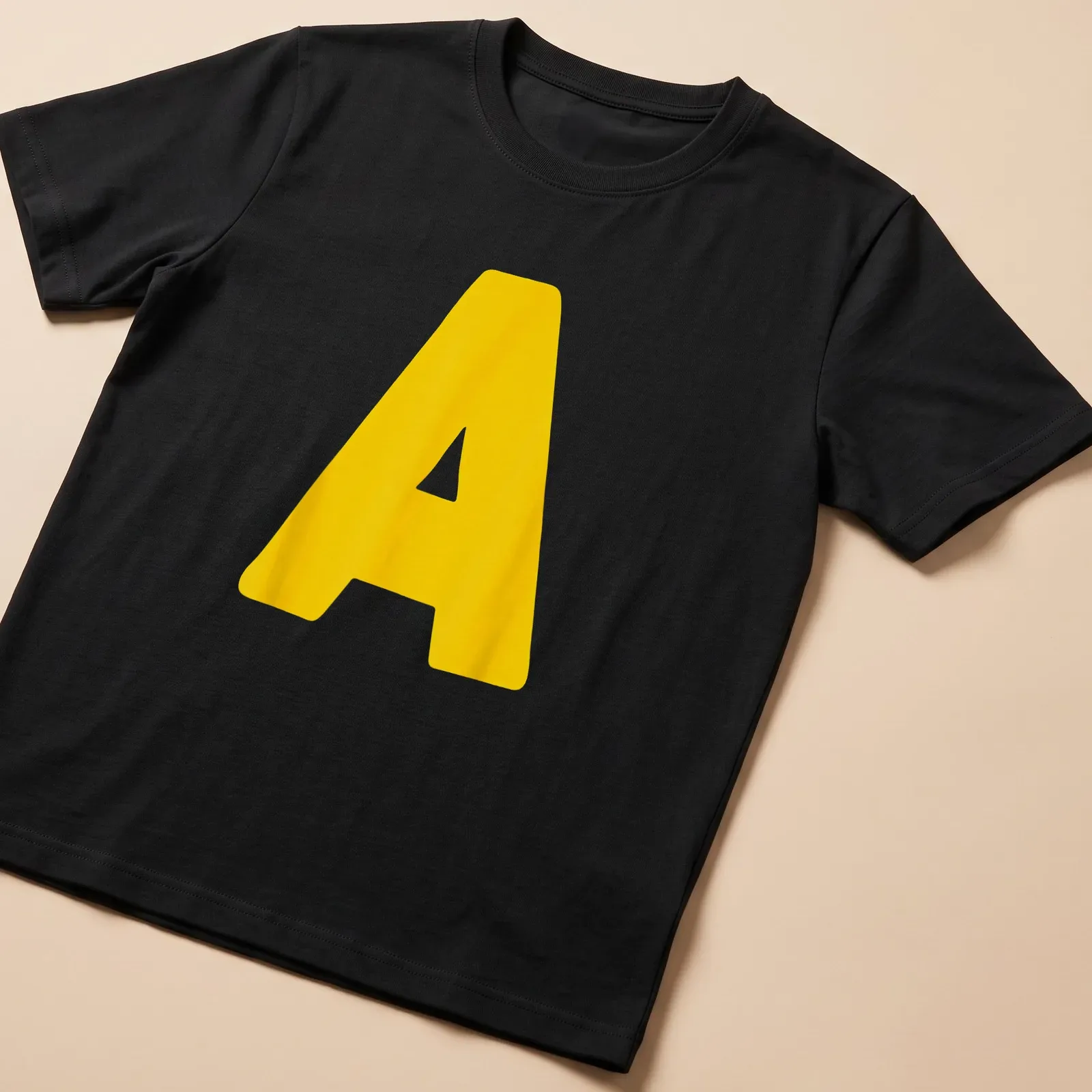 Bold yellow Letter A graphic on a Halloween costume — printed on a unisex t-shirt