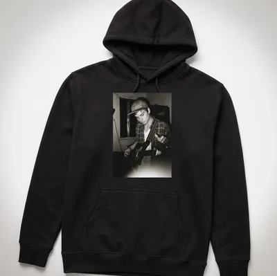 Vintage black and white photo of musician Mac DeMarco playing guitar — printed on a unisex hoodie