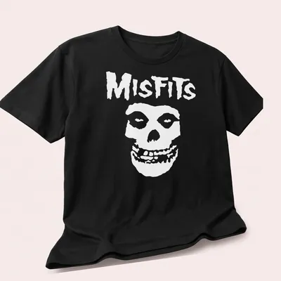 Bold graphic of a skull with the word Misfits in black and white. — printed on a unisex t-shirt (angled view)