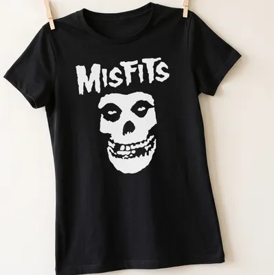 Bold graphic of a skull with the word Misfits in black and white. — printed on a women's shirt