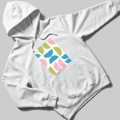 T-shirt featuring a textured pattern of semicircle shapes in various colors. — printed on a unisex hoodie