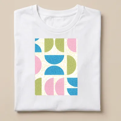 T-shirt featuring a textured pattern of semicircle shapes in various colors.