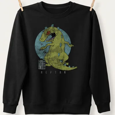 Cartoon monster playfully destroying city buildings in yellow and blue — printed on a unisex sweatshirt