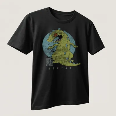 Cartoon monster playfully destroying city buildings in yellow and blue — printed on a unisex t-shirt (angled view)