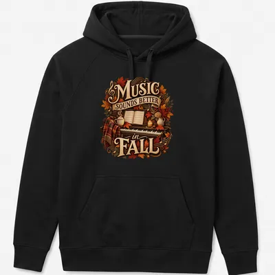 Cozy autumn-themed t-shirt with a piano and fall leaves, featuring the text 'Music Sounds Better in FALL' — printed on a unisex hoodie