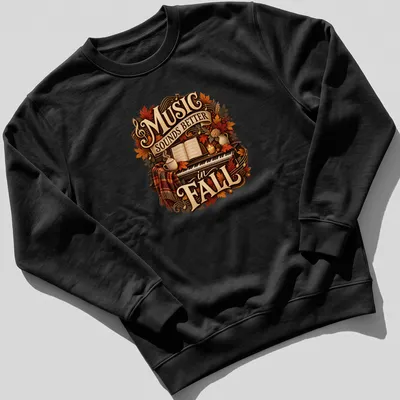 Cozy autumn-themed t-shirt with a piano and fall leaves, featuring the text 'Music Sounds Better in FALL' — printed on a unisex sweatshirt