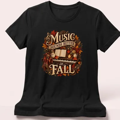 Cozy autumn-themed t-shirt with a piano and fall leaves, featuring the text 'Music Sounds Better in FALL' — printed on a women's shirt