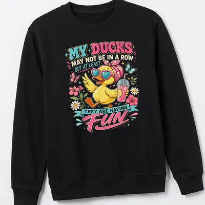 Colorful cartoon T-shirt featuring a happy yellow duck and playful text — printed on a unisex sweatshirt