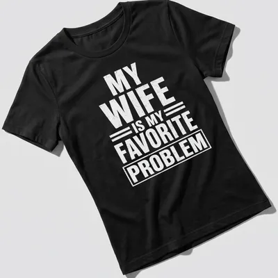 Bold typography tee with the phrase 'MY WIFE IS MY FAVORITE PROBLEM' in white — printed on a women's shirt