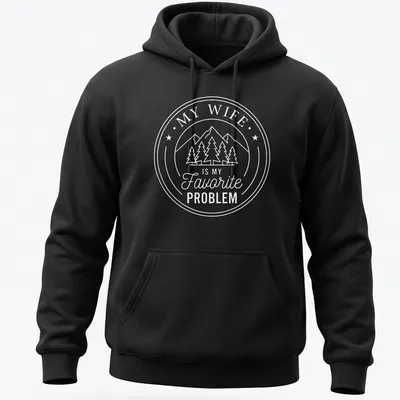 Circular badge design with mountains, pine trees, and text about a favorite problem. — printed on a unisex hoodie
