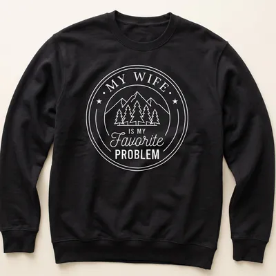 Circular badge design with mountains, pine trees, and text about a favorite problem. — printed on a unisex sweatshirt