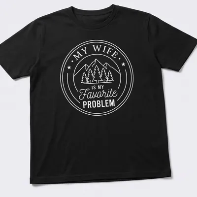 Circular badge design with mountains, pine trees, and text about a favorite problem.