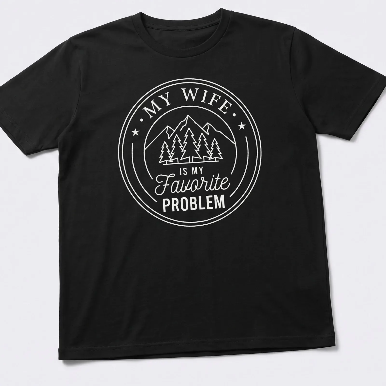 Circular badge design with mountains, pine trees, and text about a favorite problem. — printed on a unisex t-shirt