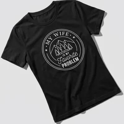 Circular badge design with mountains, pine trees, and text about a favorite problem. — printed on a women's shirt