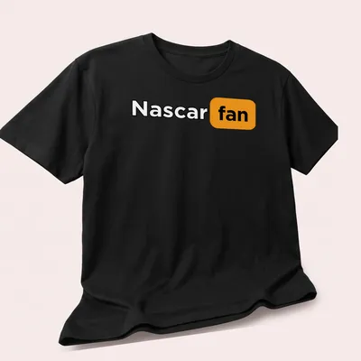 Bold Nascar Fan t-shirt with striking typography in black, orange, and white — printed on a unisex t-shirt (angled view)